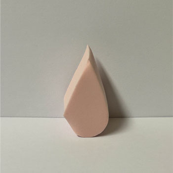 Triangular wedge make up sponge front view.