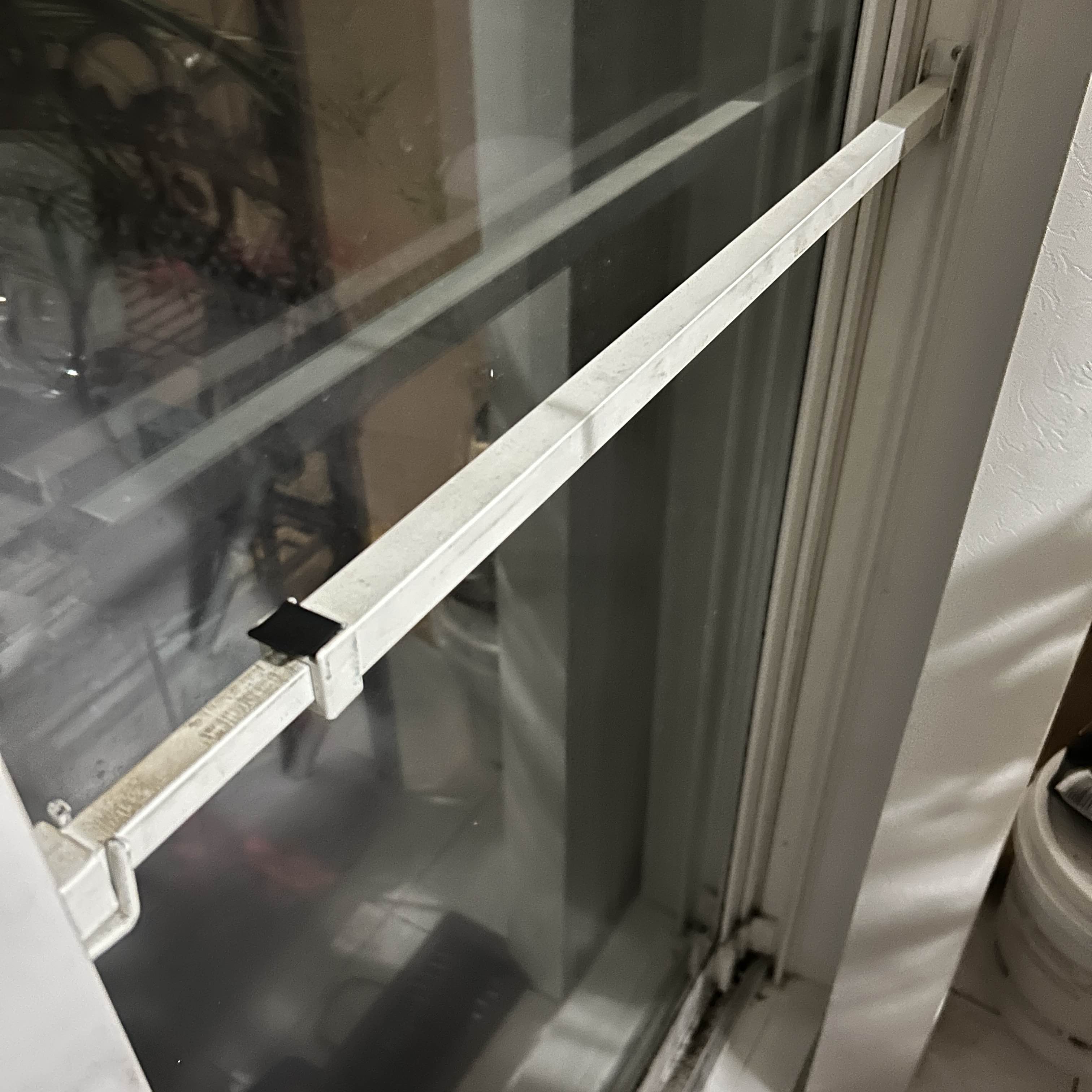 Sliding door lock down